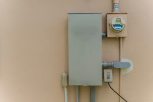 A 200-Amp automatic transfer switch mounted on the wall of a house - electrician in new orleans