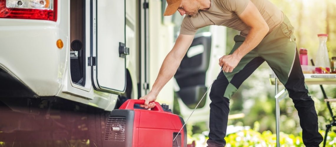 Men Firing Portable Inverter Generator Connected to His Motor Home - electrician New Orleans - B powered Electric